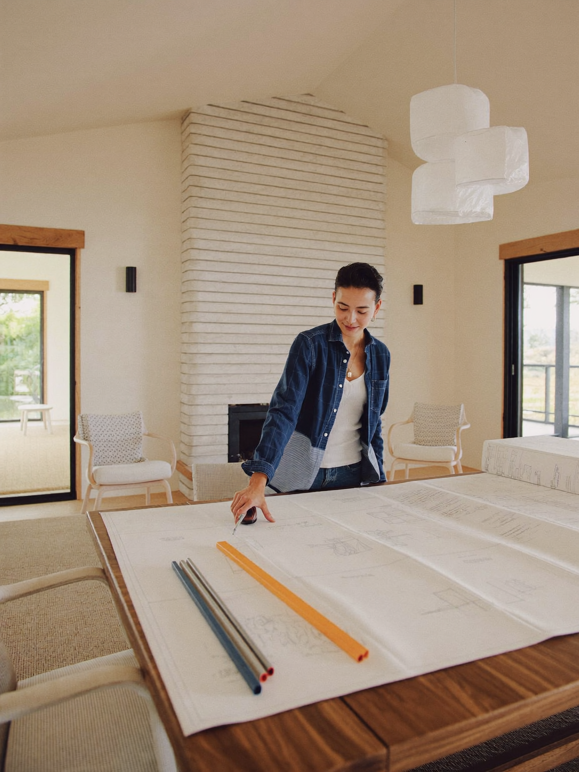 Ohana Home Remodeling designer reviewing custom blueprints for a client's renovation