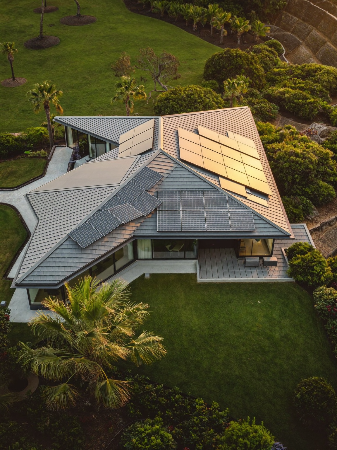 Aerial view of a home with new roof and solar panel installation